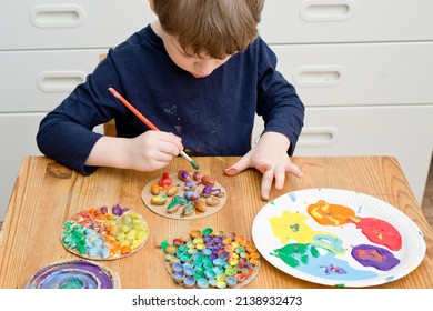 Painting of natural goods. Children's brush painting on touch surfaces glued to paper. Play at home the other way around. Do-it-yourself tasks for children. Activities for little ones.