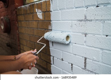 Painting On A Fresh Coat On Brick Wall