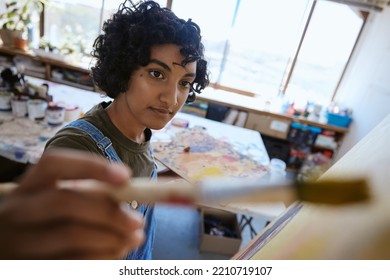 Painting, Paintbrush And Creative Indian Woman Artist In A Workshop Studio With Creative, Inspiration And Design Canvas. Young Student Painter In Artwork Process Learning Or Professional Career Work