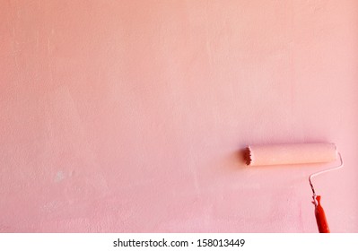 Painting Pink Wall By Rolling Brush