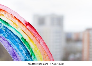 painting rainbow during Covid-19 quarantine at home. Stay at home Social media campaign for coronavirus prevention, let's all be well, hope during coronavirus pandemic concept