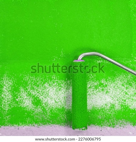 Painting a rough wall with roller. Paint roller leaving stroke of green color over a rustic background. usable for text and messages. Green background.