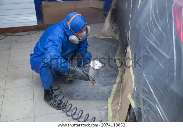 Painting the thresholds of the car.Car body\
repair. Preparation for painting car\
parts.