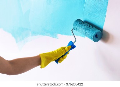 Painting wall in cyan blue color
