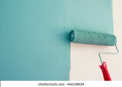 Painting of walls in a blue color. Repair in a house. 