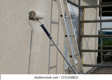 Painting Walls.Repair And Construction Concept.Details Of Painting Walls, Roller,staircase, Scaffolding And Other Tools For Painting Walls Of The House Outside.home Renovation Outside