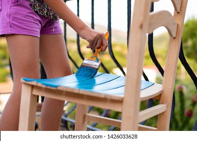 Painting Wood Chair To Blue Color At Outdoors ( Painting Chair Concept )