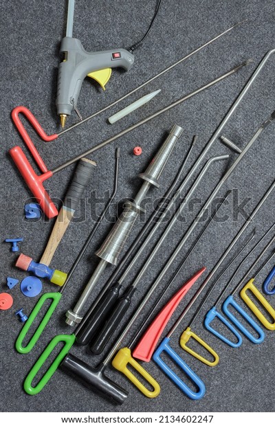Paintless
Dent Repair Kit Tools Set On The Work Table.
