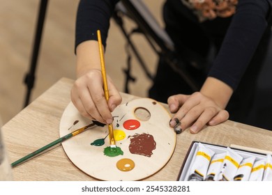 Paints and a palette for school painting classes for children - Powered by Shutterstock