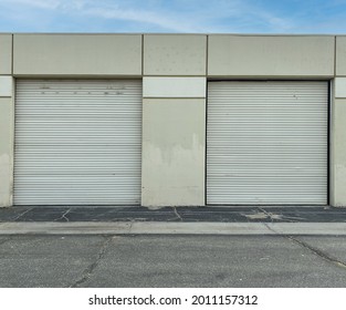 A Pair Of 2 Warehouse Shipping Industrial Shipment Roll Up Door Storage Concrete Factory Building 