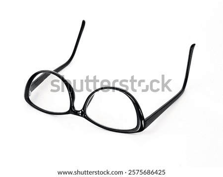Pair of back glasses with a cateye shape frame isolated on a plain white background. Copy space. 
