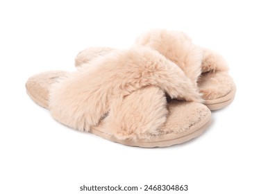 Pair of beige soft slippers isolated on white