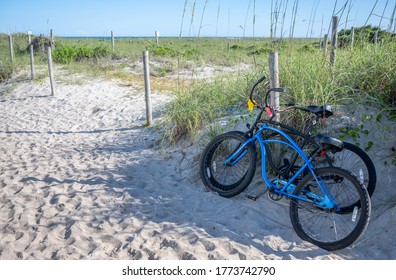 A pair of bicycles on a light sand dune trail. - Powered by Shutterstock