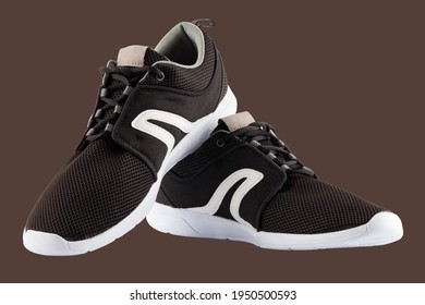 Pair Of Black Airmesh Summer Walking Lightweight Shoes Isolated On Brown Background