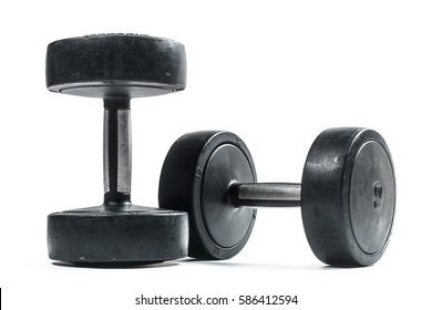 Pair of black dumbbells isolated on a white background. - Shutterstock ID 586412594