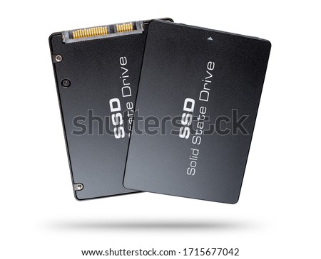 pair of black golden SSD solid state drive computer hard disk flash memory front and back side isolated on white background. pc data backup modern technology concept