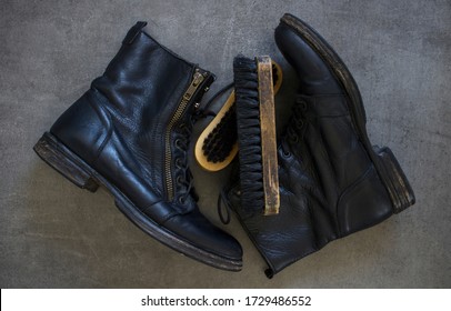 Pair Of Black Leather Retro Shoes And Wooden Shoe Brush On Grey Background With Copy Space. 
