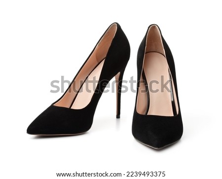 Pair of black suede high heel shoes isolated on white