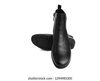 Pair of black women's leather boots isolated on white background. Short demi-season shoes, fashion and shopping concept