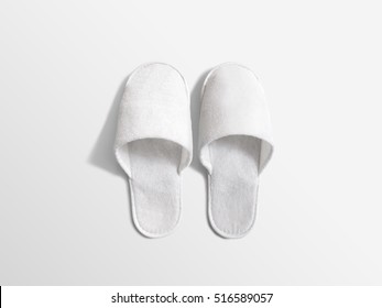 Pair of blank soft white home slippers, design mockup. House plain flops mock up template top view. Clear warm domestic sandal. Bed shoes accessory footwear.