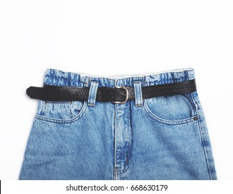 Pair Of Blue Vintage High-waisted Mom Jeans With Black Belt Isolated On White Background. Flat Lay.Top View. Copy Space.