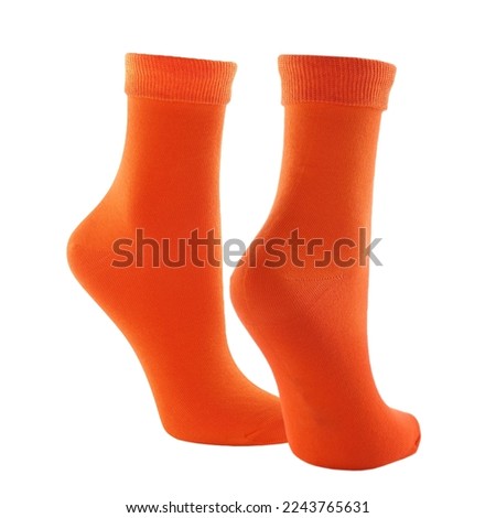 Pair of brigh orange socks isolated on white