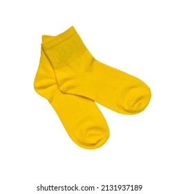 A pair of bright yellow sports socks isolated on a white background. A stylish sports accessory. Flat lay.