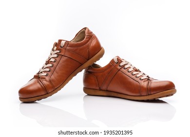 Pair Of Brown Leather Men's Shoes On A White Background. Footwear Product Shot