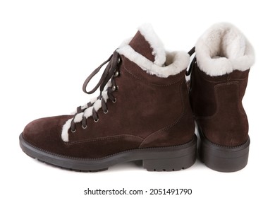 A Pair Of Brown Suede Boots With White Fur Trim, On A White Background, Isolate