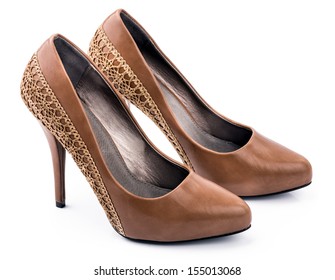Pair of Brown woman shoes An elegant pair of woman's brown shoes on a white background.