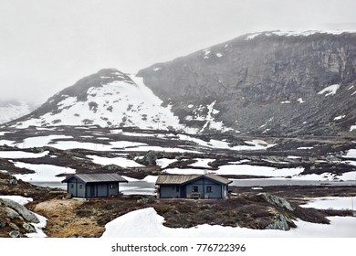 Pair of cabins in rugged mountain setting 