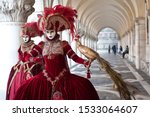 A pair of carnival masks in Piazza San Marco in Venice. Italy