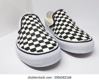 A Pair Of Checkerboard Shoes Style In With Clean Background