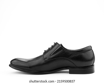 A pair of classic leather elegant men's shoes isolated white background. Groom's stylish black shoes. Isolated object close up on white background. Left side view.