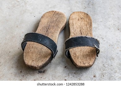 a pair of clogs for turkish bath.shoes with a thick wooden sole.
