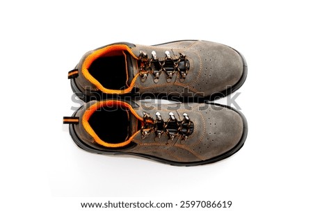 Pair of comfortable Brown working boots isolated on white, top view. 