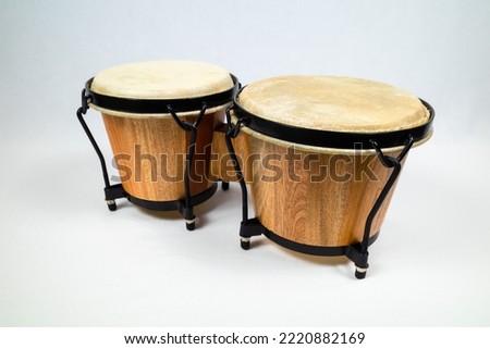 A pair of congas percussive instruments on the white background