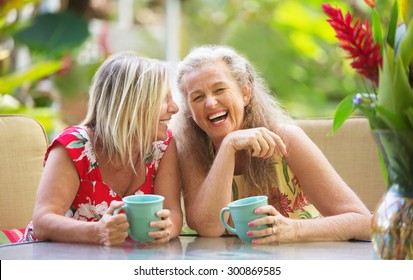Pair Of Cute Middle Aged Female Friends Laughing