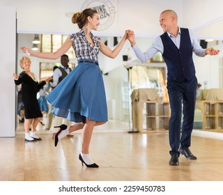 Pair dancing lindy hop during rehearsal - Powered by Shutterstock