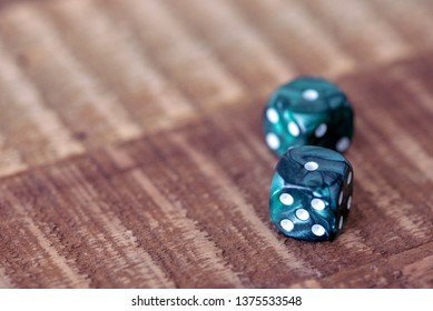 Pair Of Dice (snake Eyes) On A Rough Wood Surface.