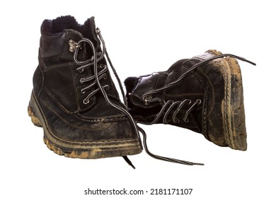 A Pair Of Dirty Boots Isolated Over A White Background