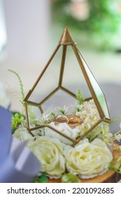 A Pair Of Engagement Rings In A Jewelry Case