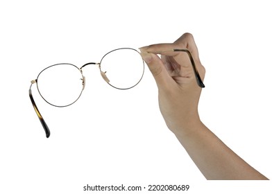 a pair of eyeglasses in the female hand on a white background