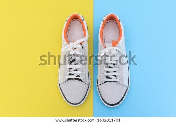 Pair Fashion White Sneakers On Yellow Stock Photo (Edit Now) 1602011701