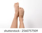 Pair of feet against a white background.