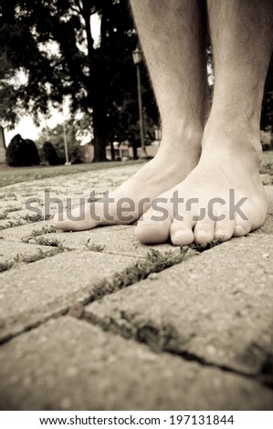 Similar – Feet standing on stone spiral staircase