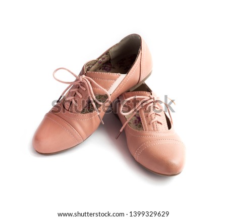 Pair of female shoes isolated on white background