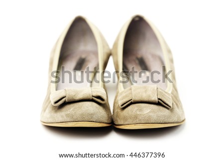 Pair of female shoes over white background