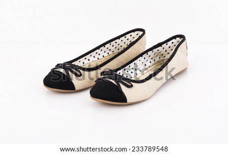 Pair of female summer ballerinas shoes with bow on white background