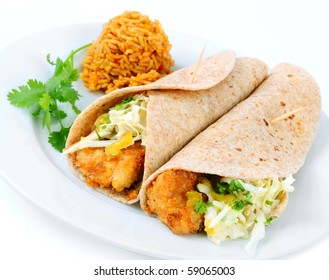 A Pair Of Fish Tacos Served With Spanish Rice On A White Background